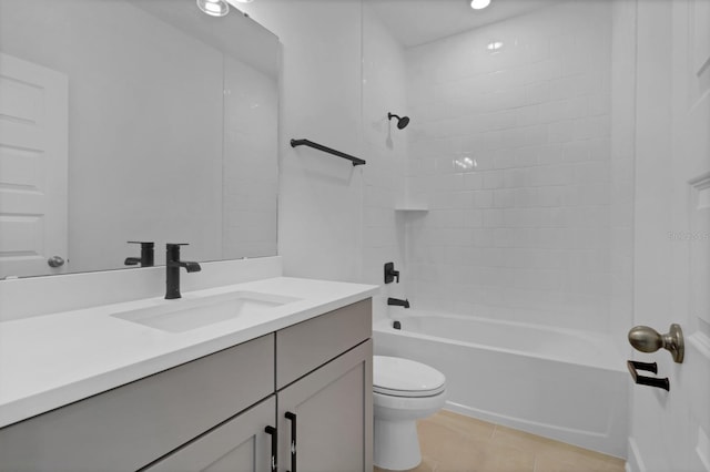 full bathroom featuring tile patterned flooring, toilet, vanity, and shower / bath combination