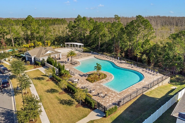 view of swimming pool with a patio, a lawn, and a pergola