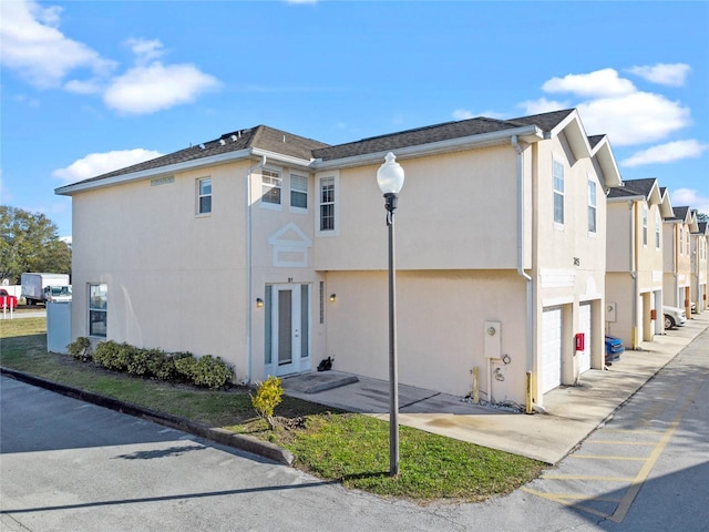 view of side of home with a garage