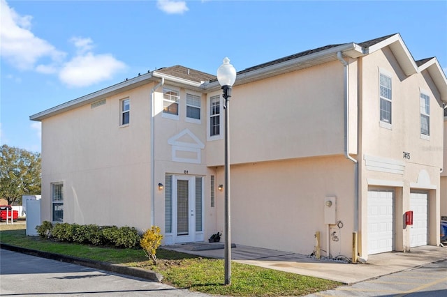 view of front of home featuring a garage and french doors