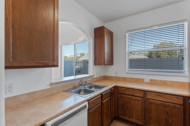 kitchen with sink, light tile patterned floors, and dishwasher