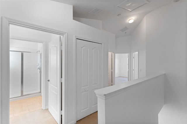 hallway featuring light tile patterned flooring