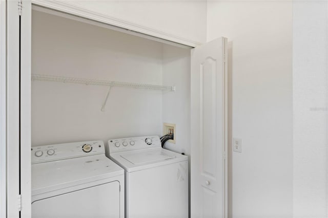 washroom featuring independent washer and dryer