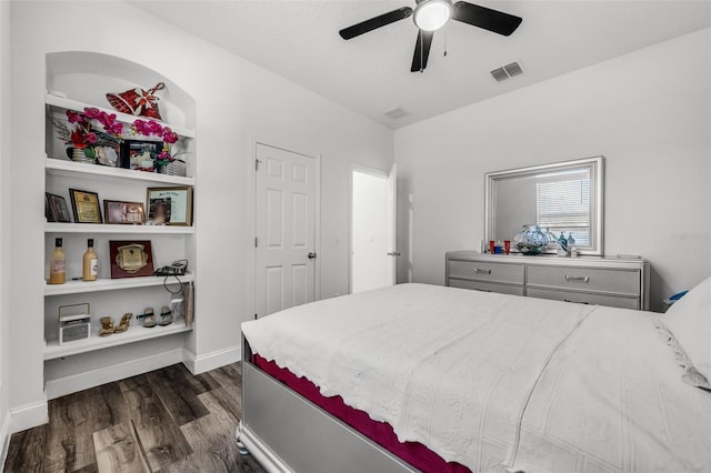 bedroom featuring ceiling fan and dark wood-type flooring