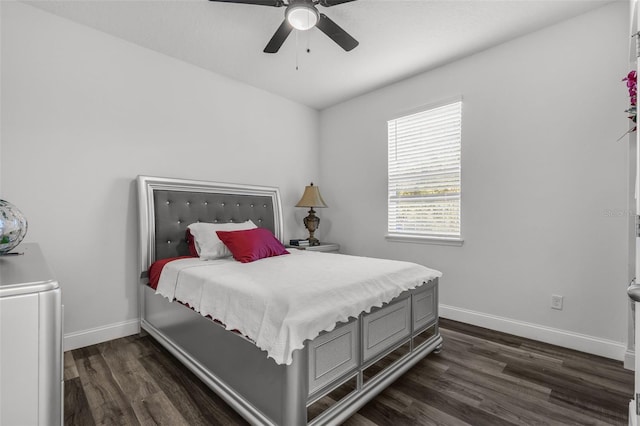 bedroom with ceiling fan and dark hardwood / wood-style floors