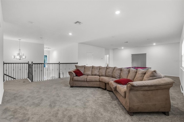 living room featuring light carpet and a notable chandelier