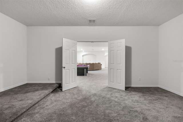 interior space with a textured ceiling