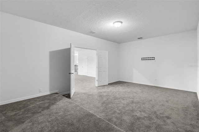 spare room featuring a textured ceiling