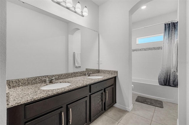 full bathroom with tile patterned floors, vanity, toilet, and shower / bathtub combination with curtain