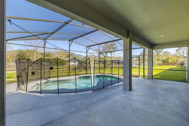 view of swimming pool featuring a lanai, a patio area, and a yard