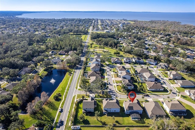 drone / aerial view with a water view