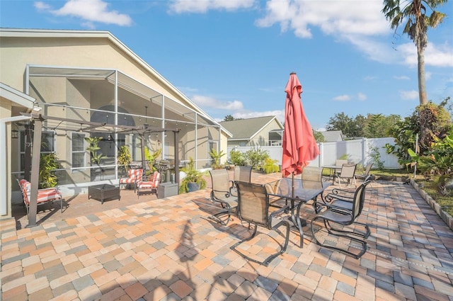 view of patio / terrace featuring a lanai and an outdoor living space