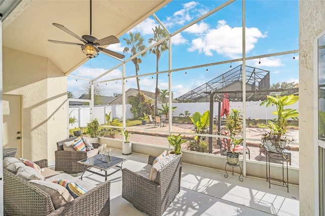 view of patio with a lanai, ceiling fan, and outdoor lounge area