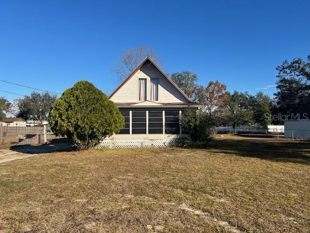 view of side of property featuring a yard