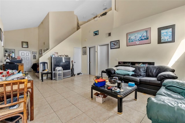 tiled living room with high vaulted ceiling