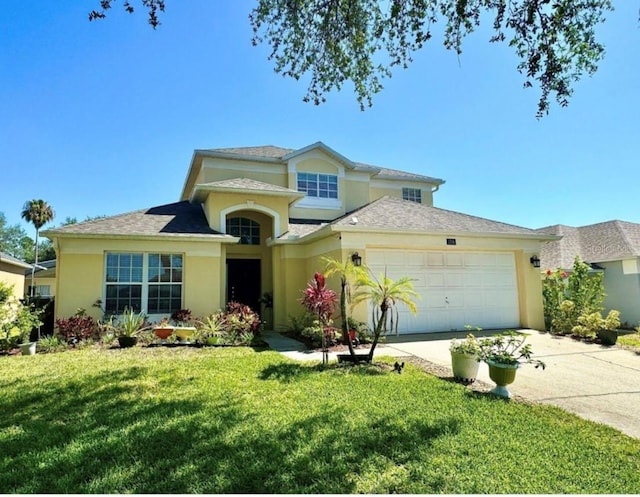 view of front of property with a front lawn and a garage