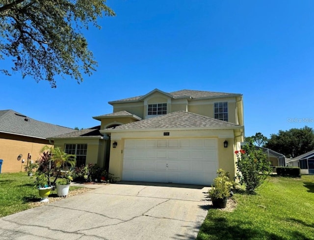 view of front of house featuring a front yard and a garage