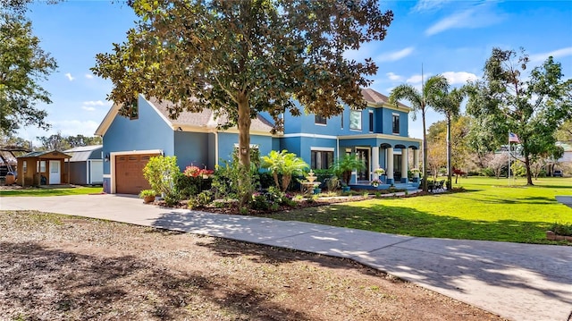 view of front of house with a garage and a front lawn