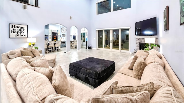 living room featuring hardwood / wood-style flooring and a high ceiling