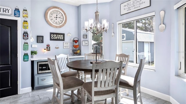 dining area featuring a chandelier