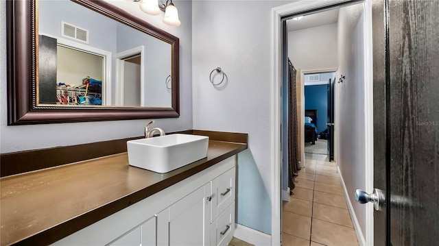 bathroom with vanity and tile patterned flooring