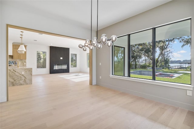 interior space featuring a notable chandelier and light hardwood / wood-style floors