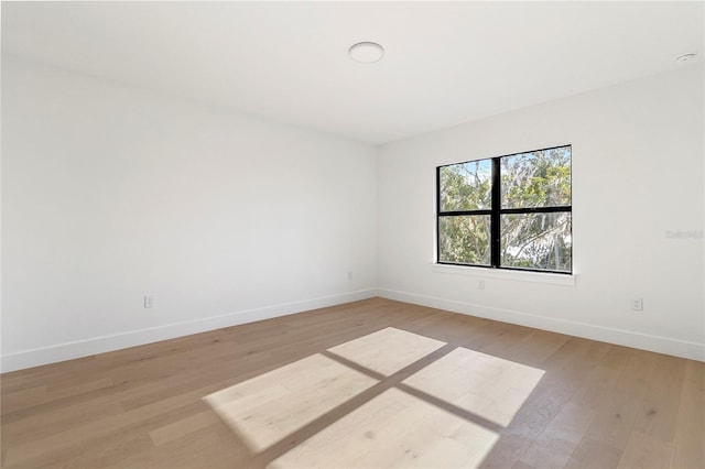 unfurnished room featuring light wood-type flooring