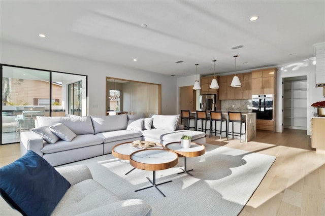 living room with light hardwood / wood-style floors