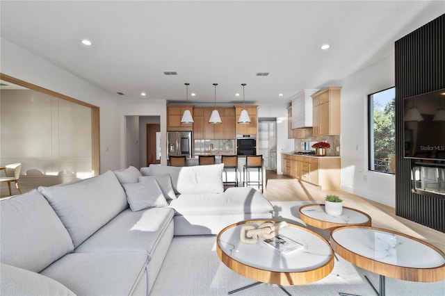 living room with light hardwood / wood-style flooring