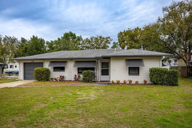 single story home with a garage and a front yard