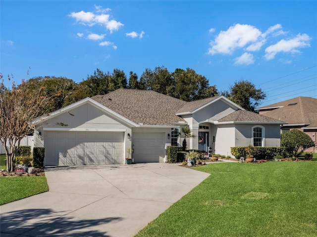 single story home with a garage and a front lawn