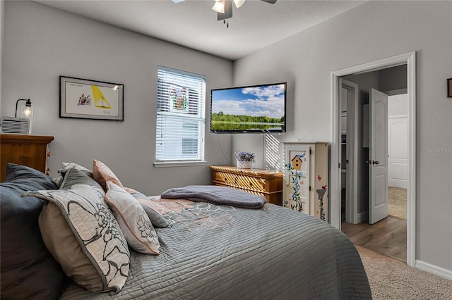 carpeted bedroom featuring ceiling fan