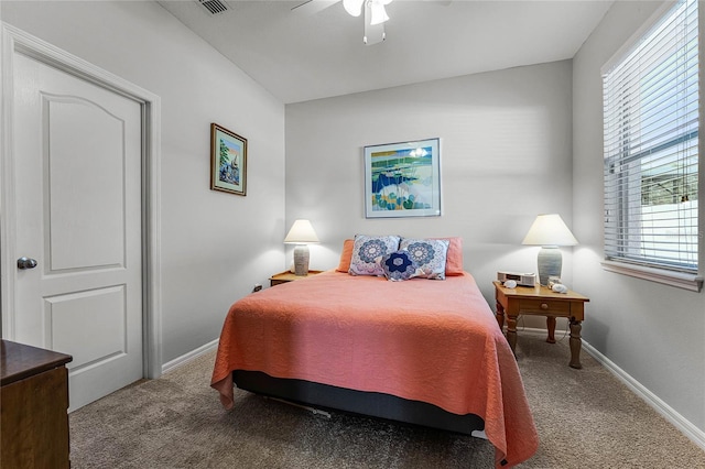 bedroom with ceiling fan, carpet flooring, and baseboards