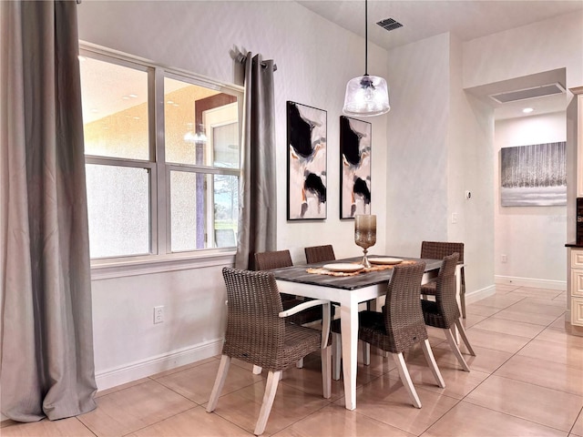 dining room with light tile patterned flooring