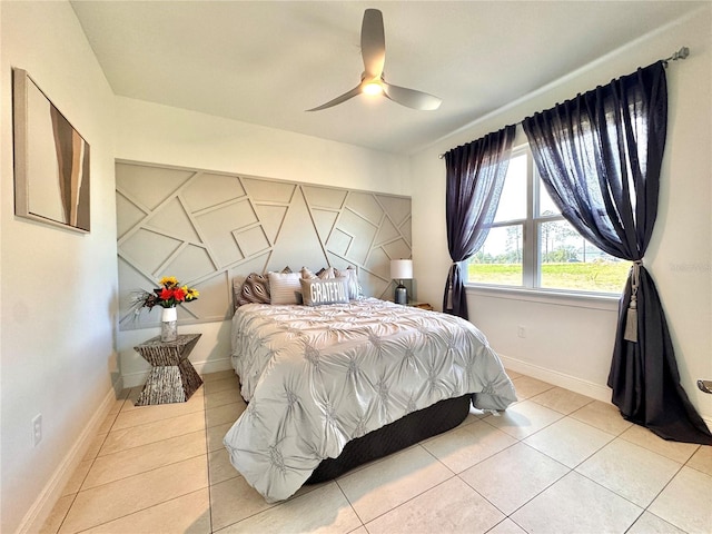 bedroom featuring light tile patterned floors and ceiling fan