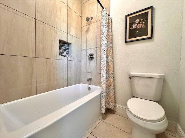 bathroom with toilet, shower / tub combo, and tile patterned floors