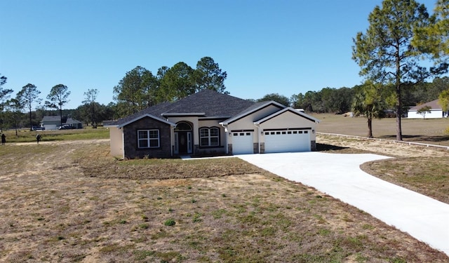 ranch-style house with a garage and a front yard