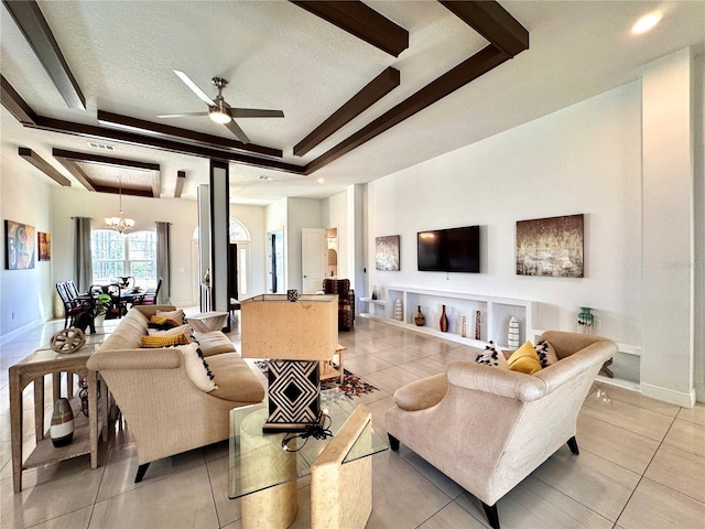 living room featuring a textured ceiling, light tile patterned flooring, ceiling fan with notable chandelier, and a tray ceiling