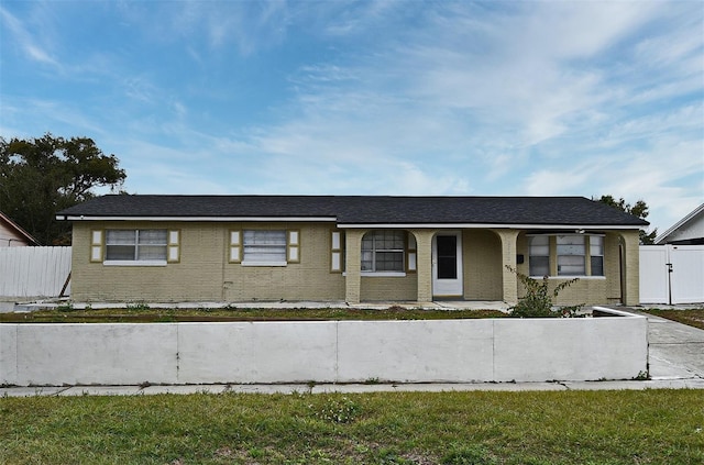 ranch-style house featuring a front lawn