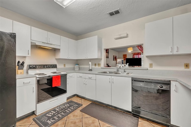 kitchen with sink, white cabinets, black appliances, and light tile patterned floors