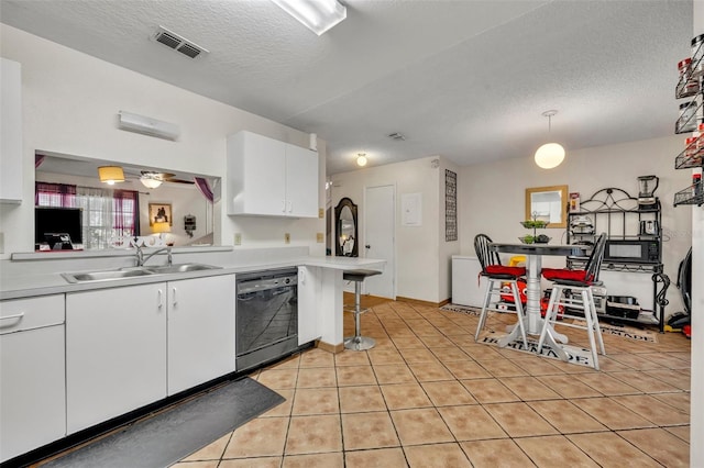 kitchen featuring white cabinetry, dishwasher, sink, kitchen peninsula, and pendant lighting