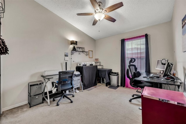 home office with a textured ceiling, ceiling fan, light carpet, and vaulted ceiling