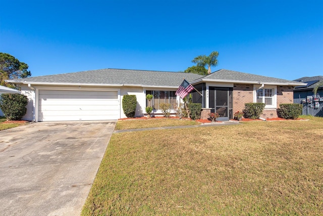 ranch-style home with a front lawn and a garage