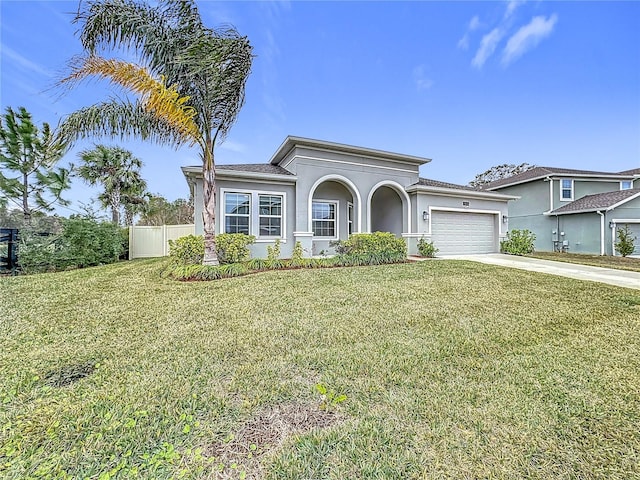 view of front of house featuring a garage and a front lawn