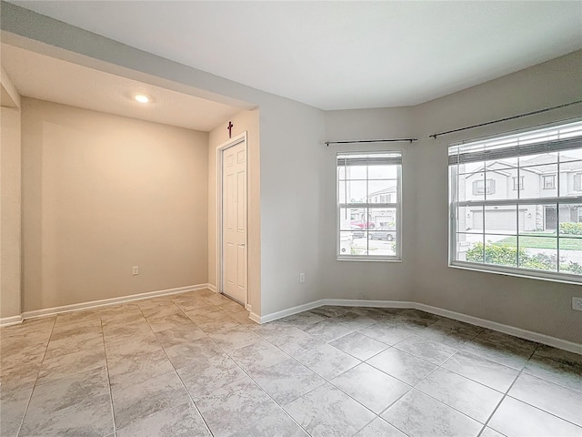 empty room featuring light tile patterned floors