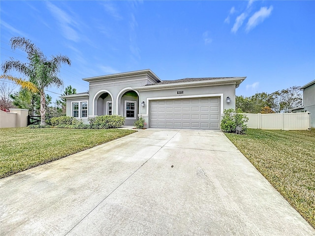 view of front of house featuring a garage and a front yard