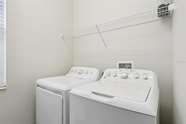 washroom featuring independent washer and dryer