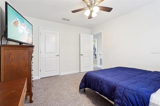 bedroom featuring ceiling fan and carpet