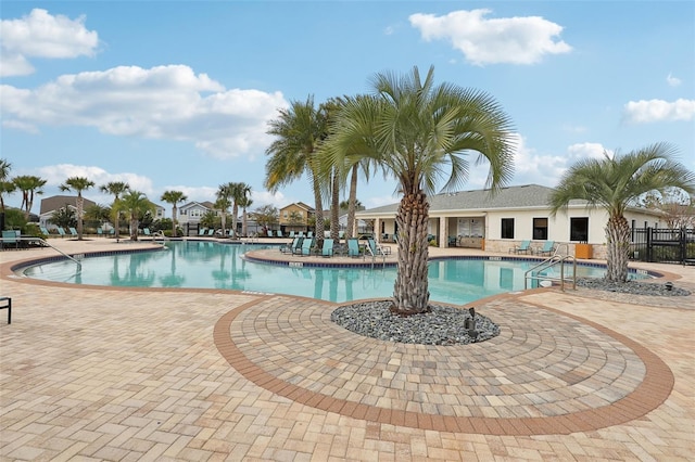 view of swimming pool featuring a patio area