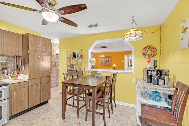 dining room with ceiling fan